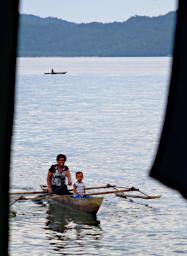 Waigeo Mom Boy In Boat