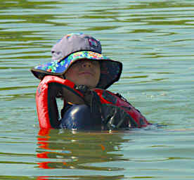 Jack Swimming by Canoe