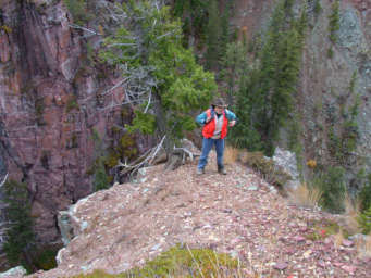 Dona on cliffs below falls